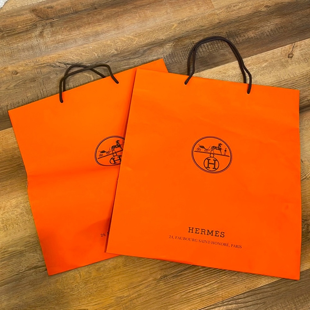 Two Large HERMES paper shopping bags.